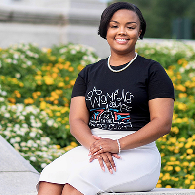 Master’s in Public Administration student Dymon Bailey in front of the Capitol in Richmond.