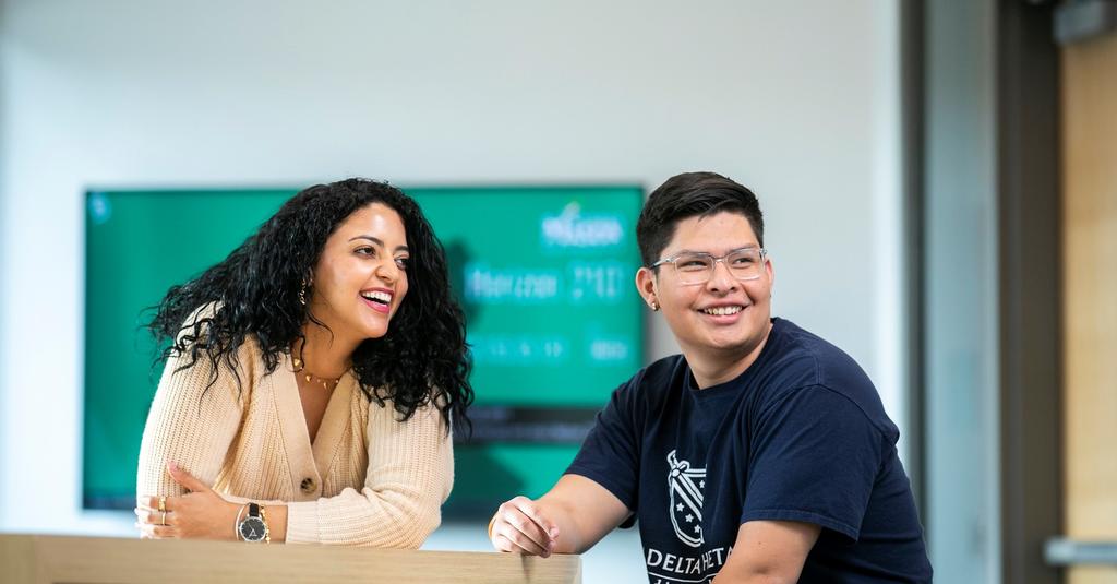 Two undergraduate students smiling